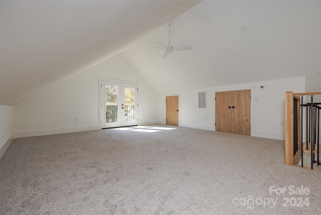 bonus room with french doors, light colored carpet, ceiling fan, and vaulted ceiling