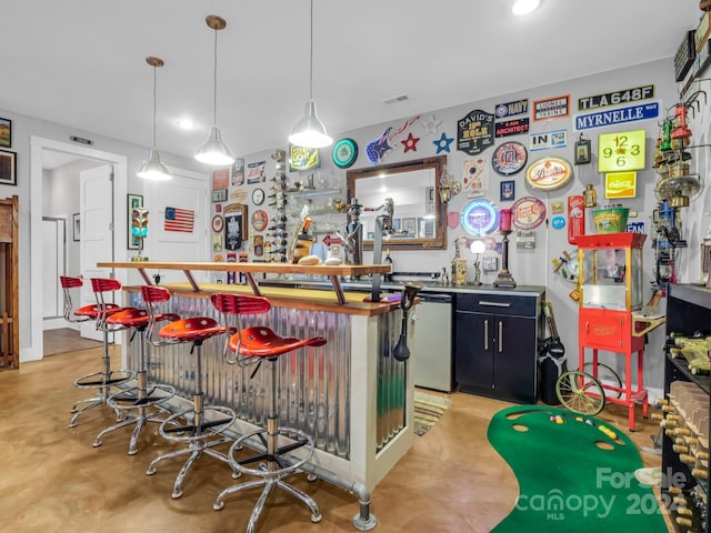 bar with pendant lighting and stainless steel dishwasher