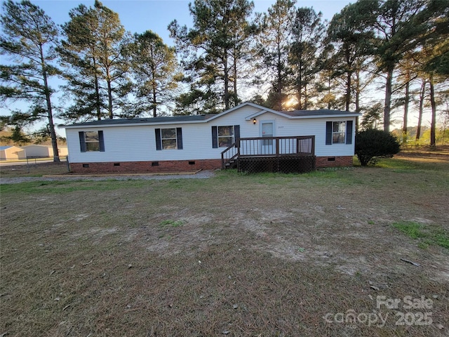 manufactured / mobile home with crawl space, a front yard, and a deck