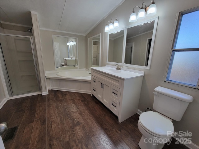 full bathroom featuring toilet, crown molding, wood finished floors, and a shower stall