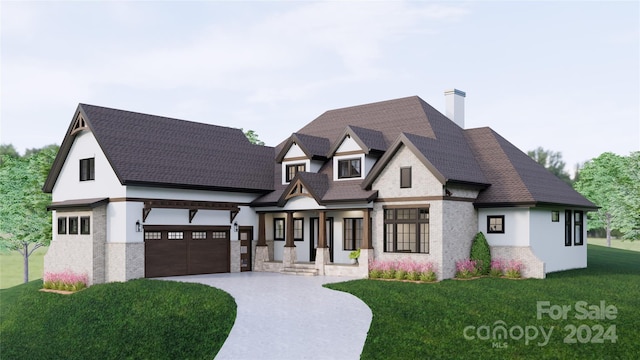 view of front facade featuring a garage and a front yard