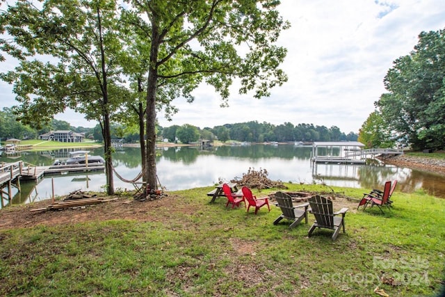 exterior space featuring a dock and a water view