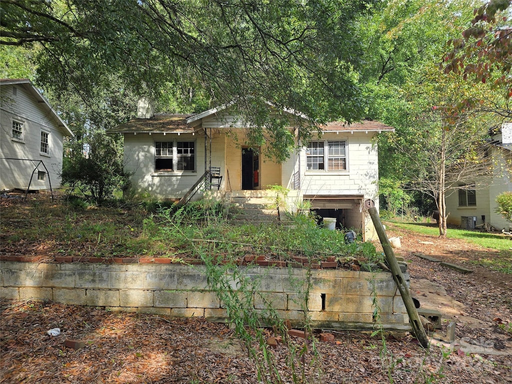 view of front of property featuring cooling unit