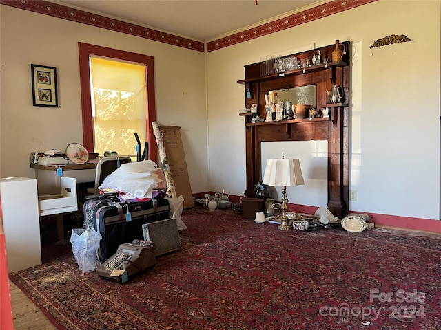 living room featuring ornamental molding and hardwood / wood-style floors