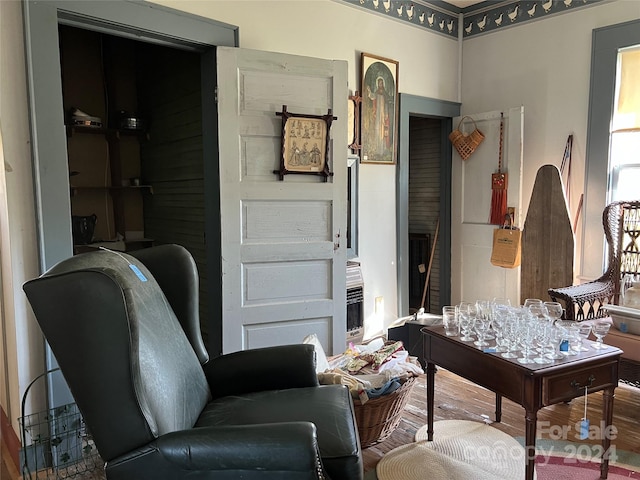 sitting room with hardwood / wood-style floors