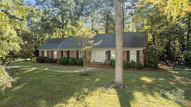 view of front of home with a front yard