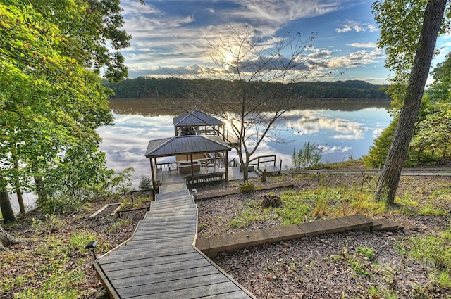 view of dock featuring a water view and a gazebo