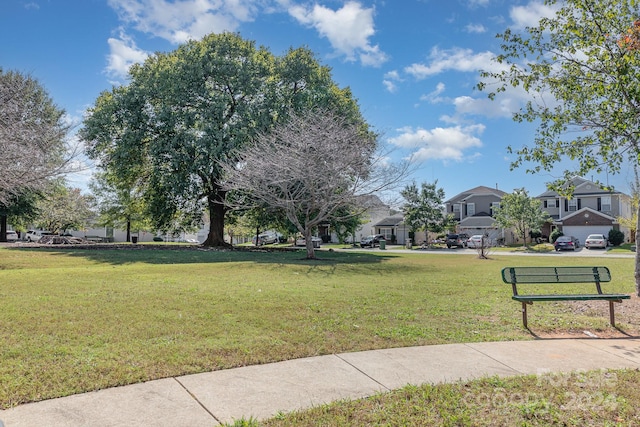 surrounding community with a yard