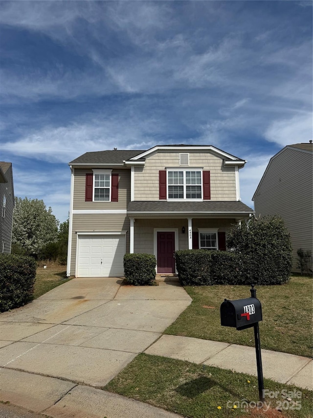 4803 Roxfield Ln, Charlotte, NC 28215 - view of front of property with an attached garage, driveway, and a front lawn