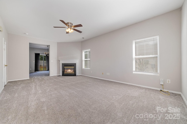 4803 Roxfield Ln, Charlotte, NC 28215 - unfurnished living room with ceiling fan, carpet floors, a fireplace with flush hearth, and baseboards