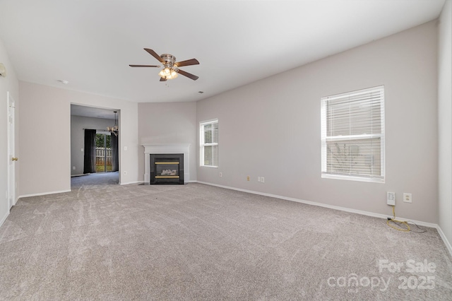 4803 Roxfield Ln, Charlotte, NC 28215 - unfurnished living room featuring a ceiling fan, carpet floors, a fireplace with flush hearth, and baseboards