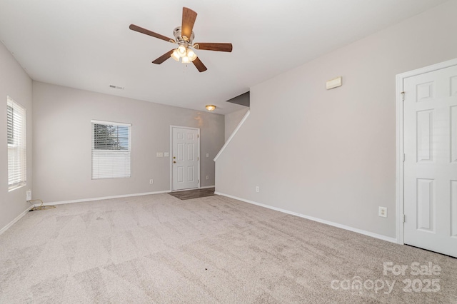 4803 Roxfield Ln, Charlotte, NC 28215 - unfurnished living room with ceiling fan, healthy amount of natural light, carpet, and baseboards