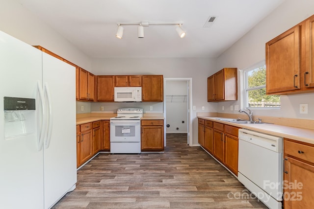 4803 Roxfield Ln, Charlotte, NC 28215 - kitchen featuring white appliances, a sink, dark wood-style floors, and brown cabinets