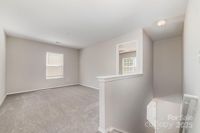 4803 Roxfield Ln, Charlotte, NC 28215 - spare room featuring carpet and baseboards