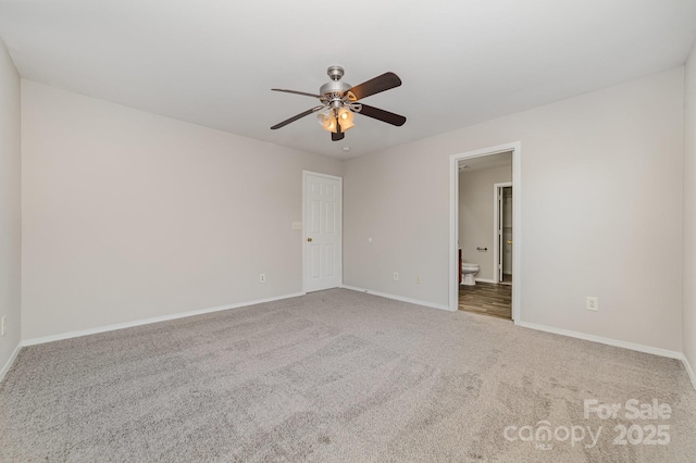 4803 Roxfield Ln, Charlotte, NC 28215 - unfurnished bedroom with baseboards, carpet flooring, connected bathroom, and a ceiling fan