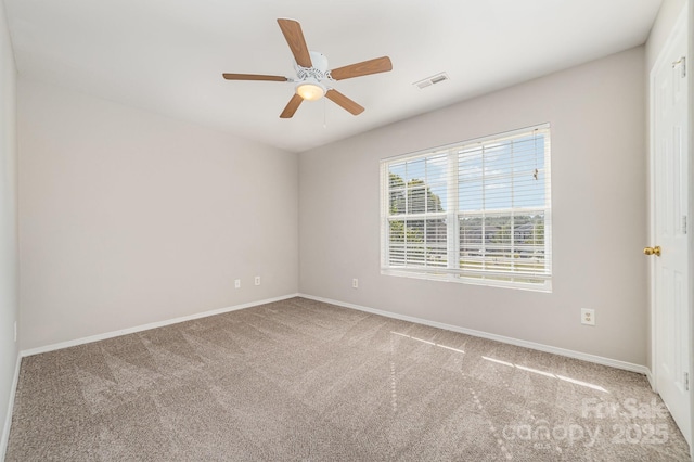 4803 Roxfield Ln, Charlotte, NC 28215 - carpeted empty room with a ceiling fan and baseboards