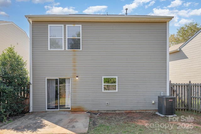 4803 Roxfield Ln, Charlotte, NC 28215 - back of property with central air condition unit, a patio area, and fence