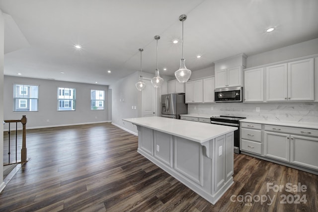 kitchen with dark wood-type flooring, backsplash, stainless steel appliances, and a kitchen island