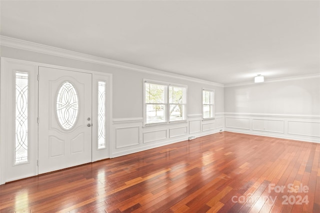 entryway featuring ornamental molding and hardwood / wood-style floors