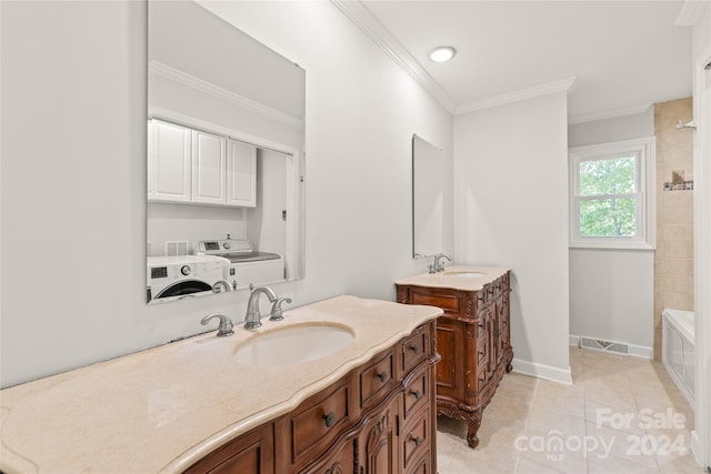 bathroom with walk in shower, washing machine and clothes dryer, vanity, crown molding, and tile patterned floors