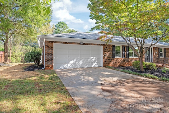 single story home with a garage