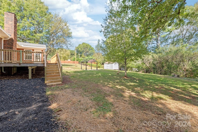 view of yard featuring a wooden deck