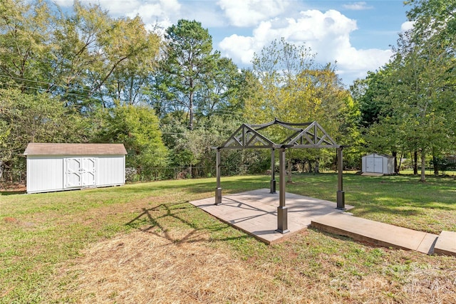 view of yard featuring a shed and a patio area