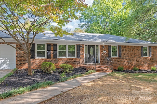 single story home with a garage