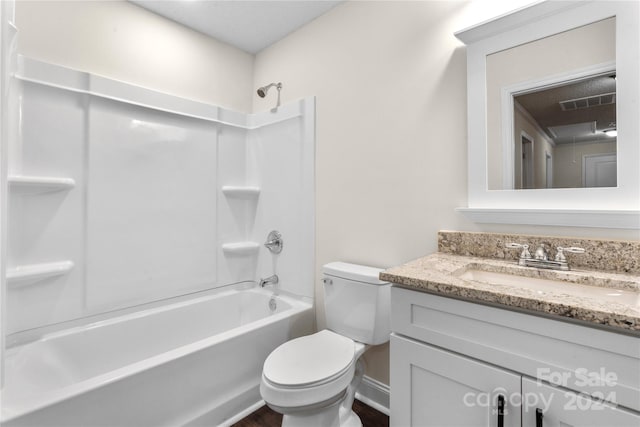 full bathroom with vanity, bathing tub / shower combination, and toilet