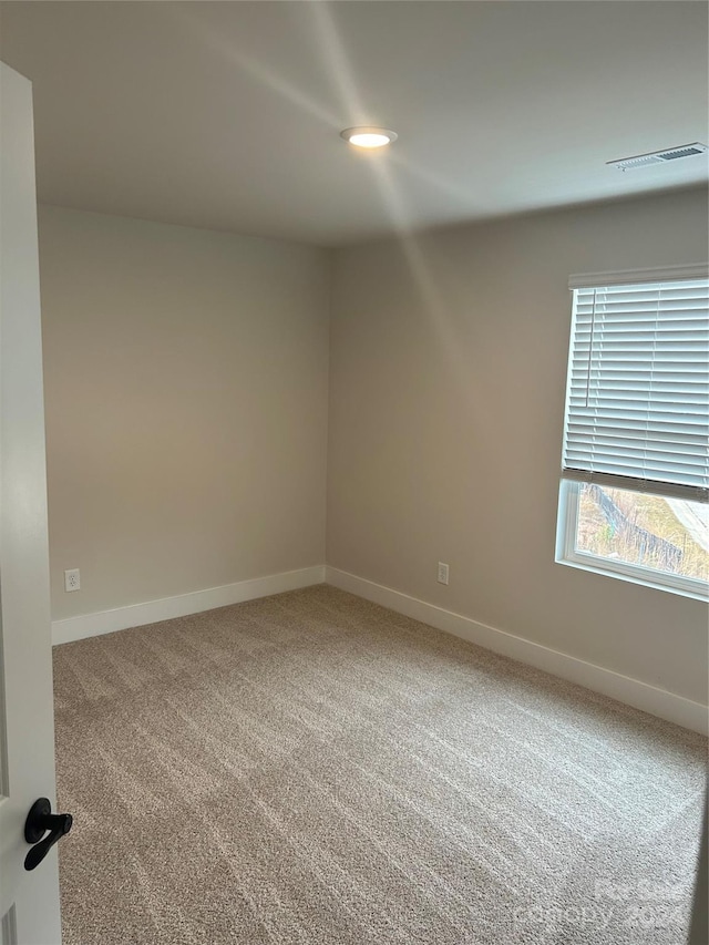 view of carpeted spare room