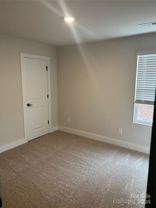 view of carpeted spare room