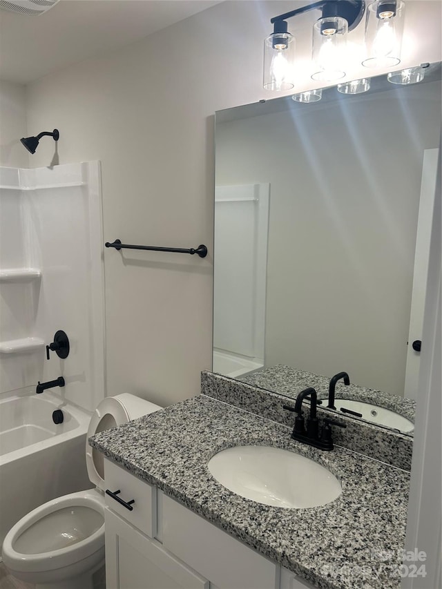 full bathroom with shower / bathing tub combination, vanity, and toilet