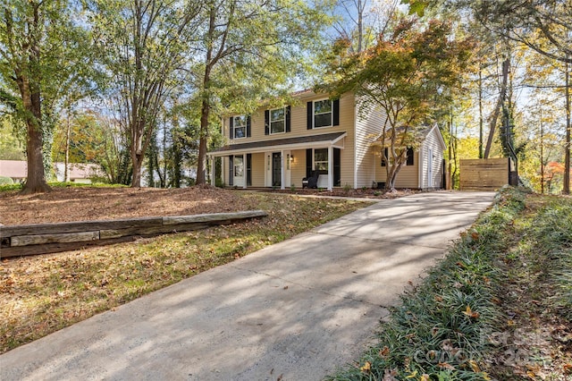 colonial house featuring a porch