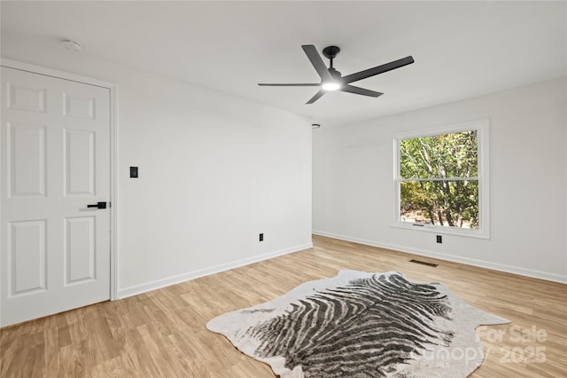 sitting room featuring ceiling fan and light wood-type flooring