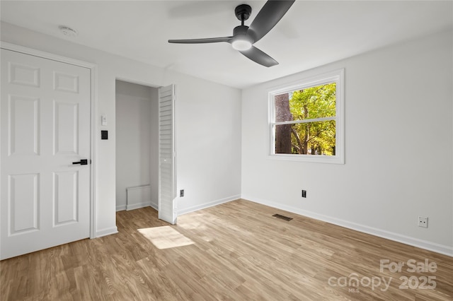 unfurnished bedroom featuring ceiling fan and light hardwood / wood-style flooring