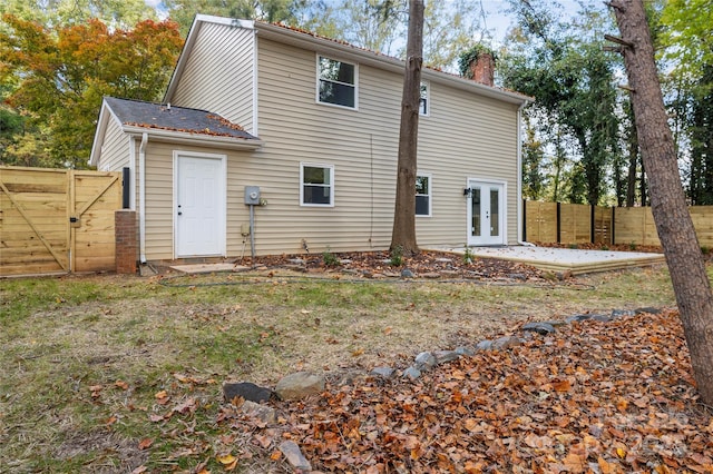 back of property featuring french doors