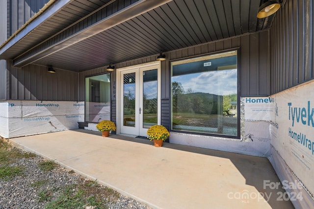 property entrance featuring french doors and a patio