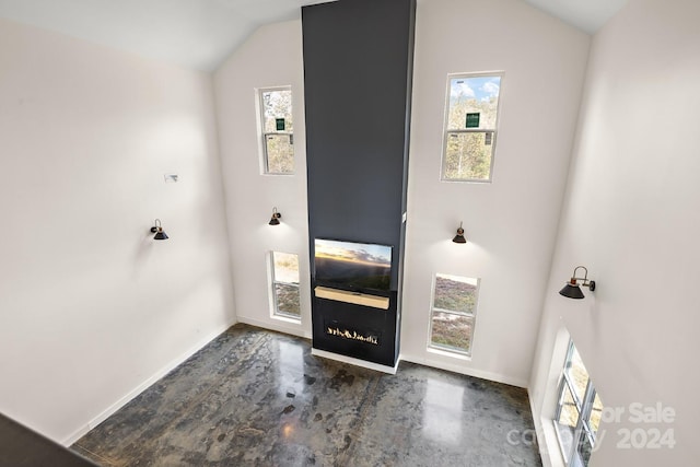 foyer entrance with lofted ceiling and a wealth of natural light