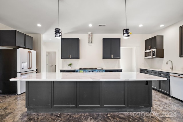 kitchen featuring pendant lighting, a large island, appliances with stainless steel finishes, and light stone countertops