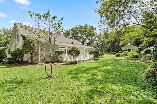 view of yard featuring covered porch