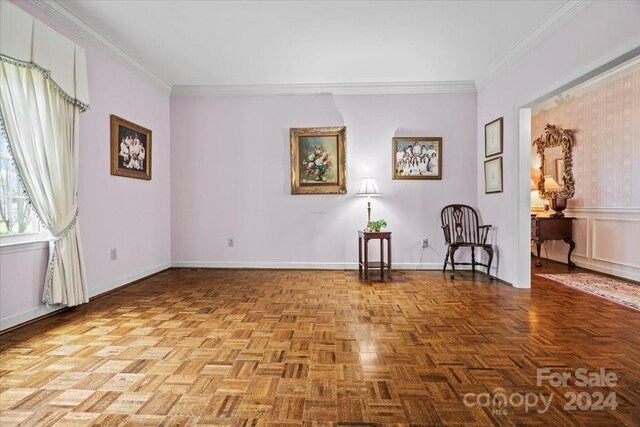 unfurnished room featuring ornamental molding and light parquet floors