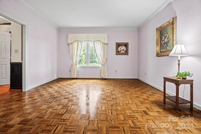 spare room with ornamental molding and light parquet flooring