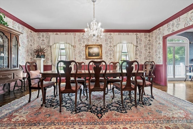 dining area with crown molding, hardwood / wood-style floors, and a wealth of natural light