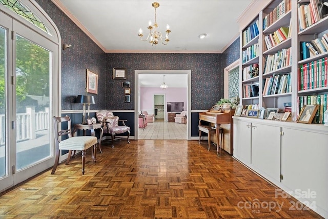 sitting room with parquet floors, crown molding, and a notable chandelier