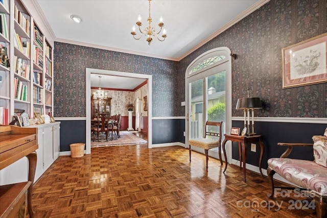 sitting room featuring ornamental molding, parquet flooring, and a chandelier