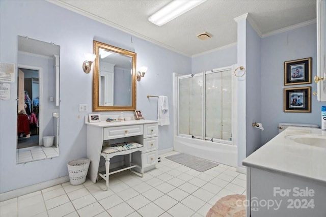 bathroom featuring vanity, tile patterned flooring, ornamental molding, combined bath / shower with glass door, and a textured ceiling