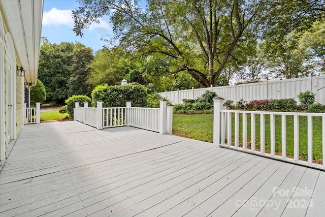 wooden deck with a yard