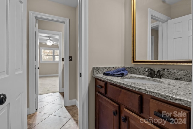 bathroom featuring tile patterned floors, ceiling fan, and vanity