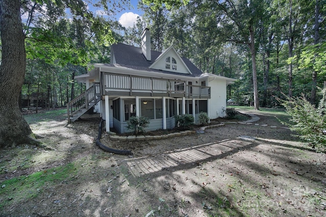 rear view of property with a deck