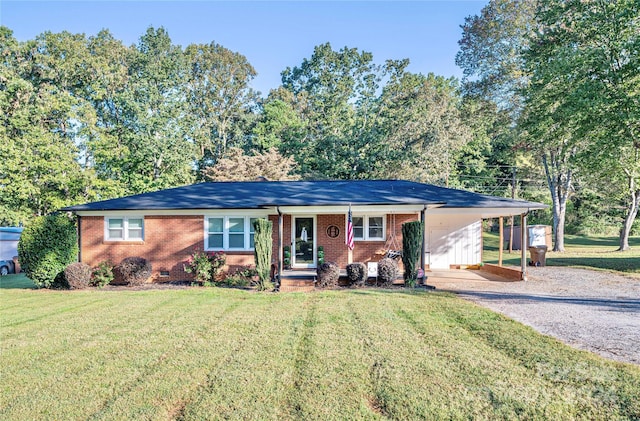 single story home featuring a carport and a front yard